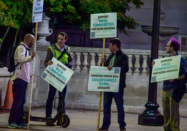 Four members of Equitable Arlington in a demonstration outside Arlington Town Hall Monday night.