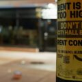 Photo of flyer that says Rent is Too High, Don't Let City Hall Block Rent Control